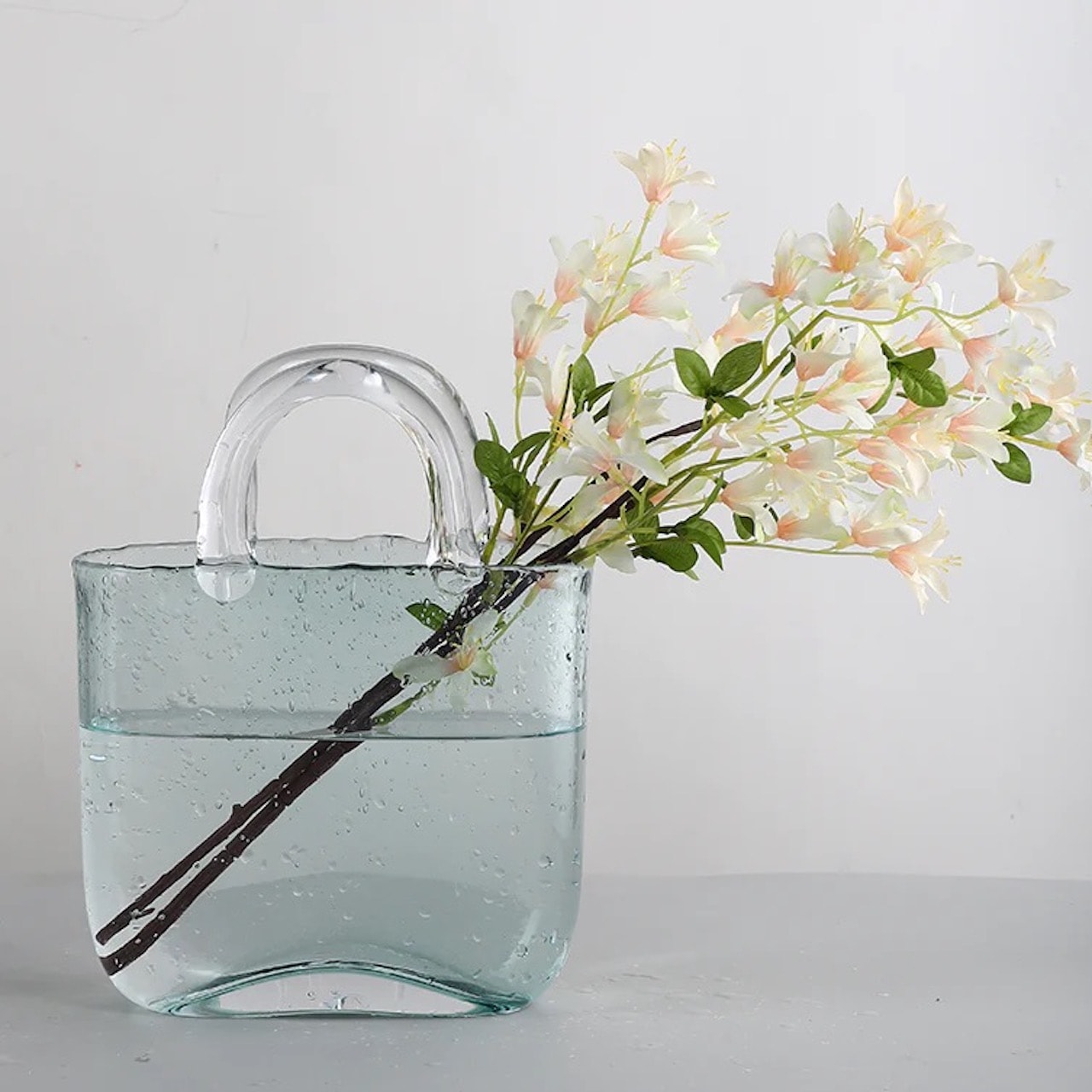 minimal-spring-mantel-decorating-ideas_clear-glass-purse-vase