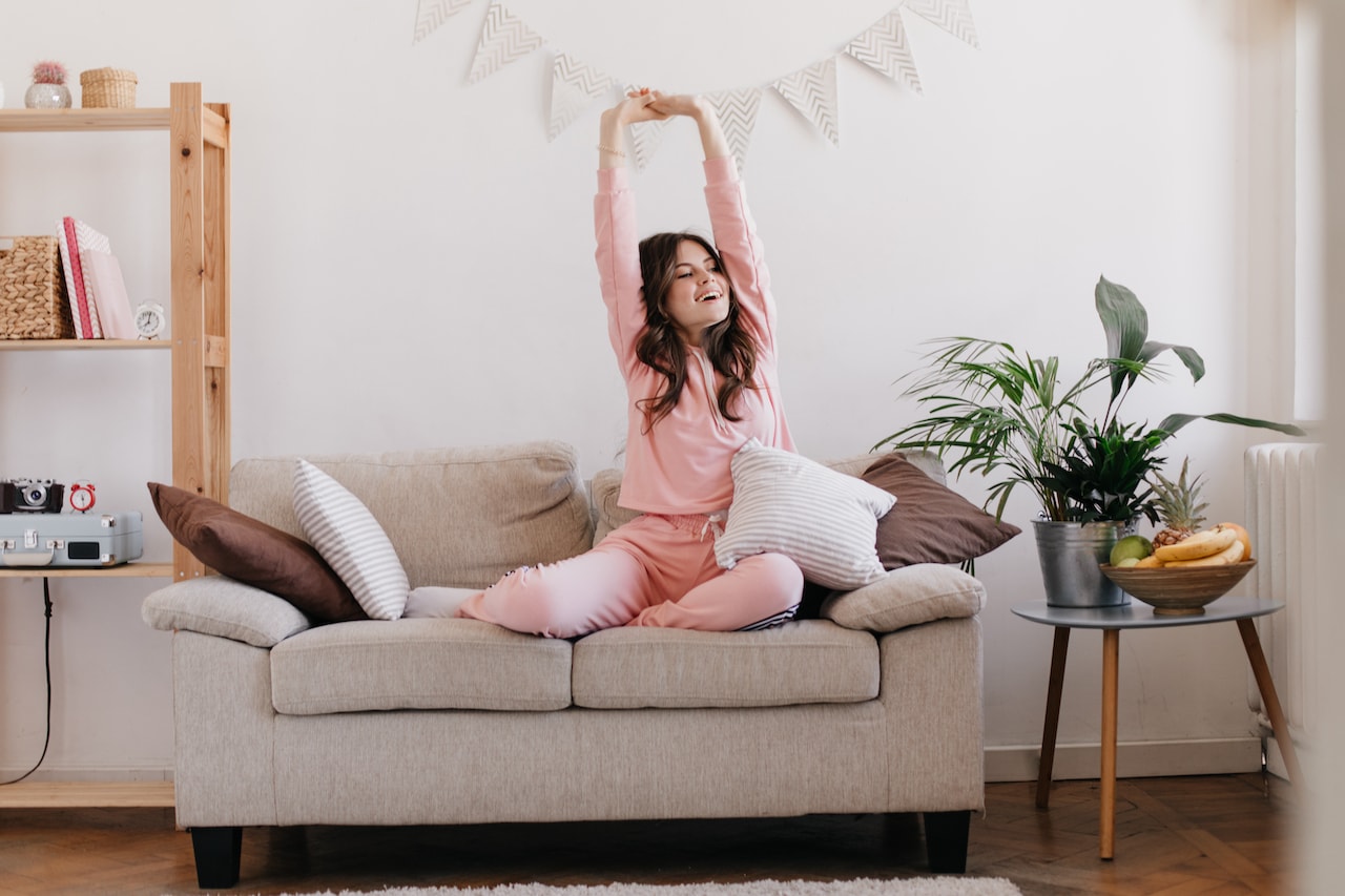 shift-the-energy-in-your-home_happy-woman-living-room