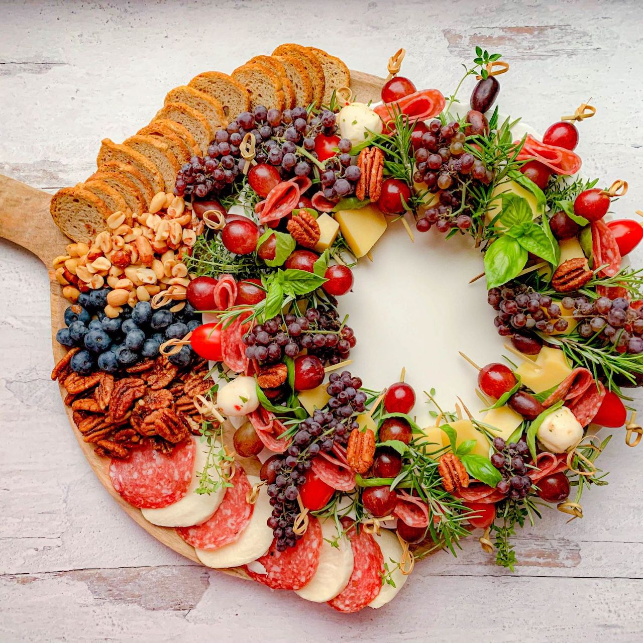 charcuterie board for the holidays christmas colorful wreath berries