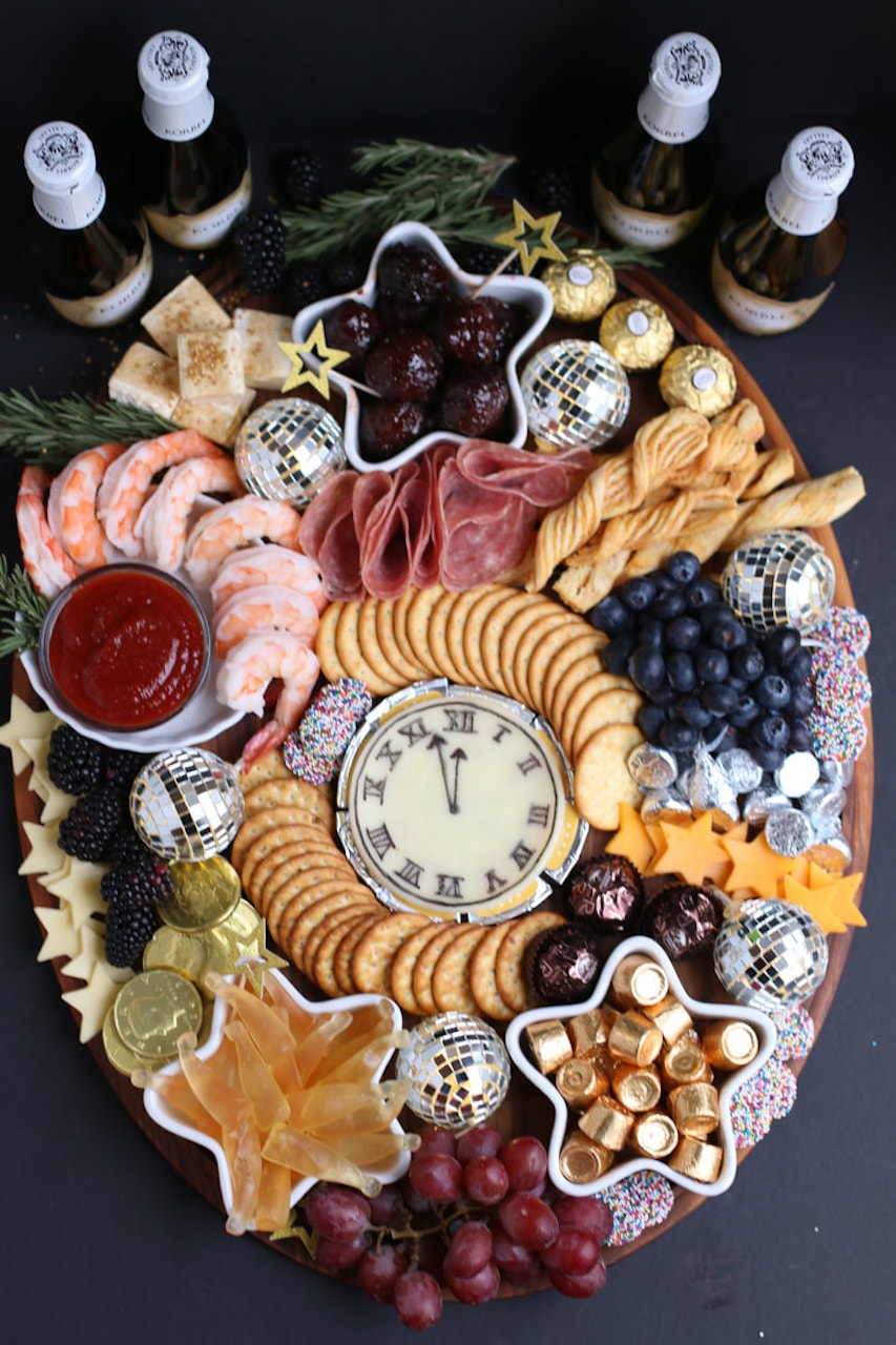 charcuterie board for the holidays christmas new years countdown clock champagne